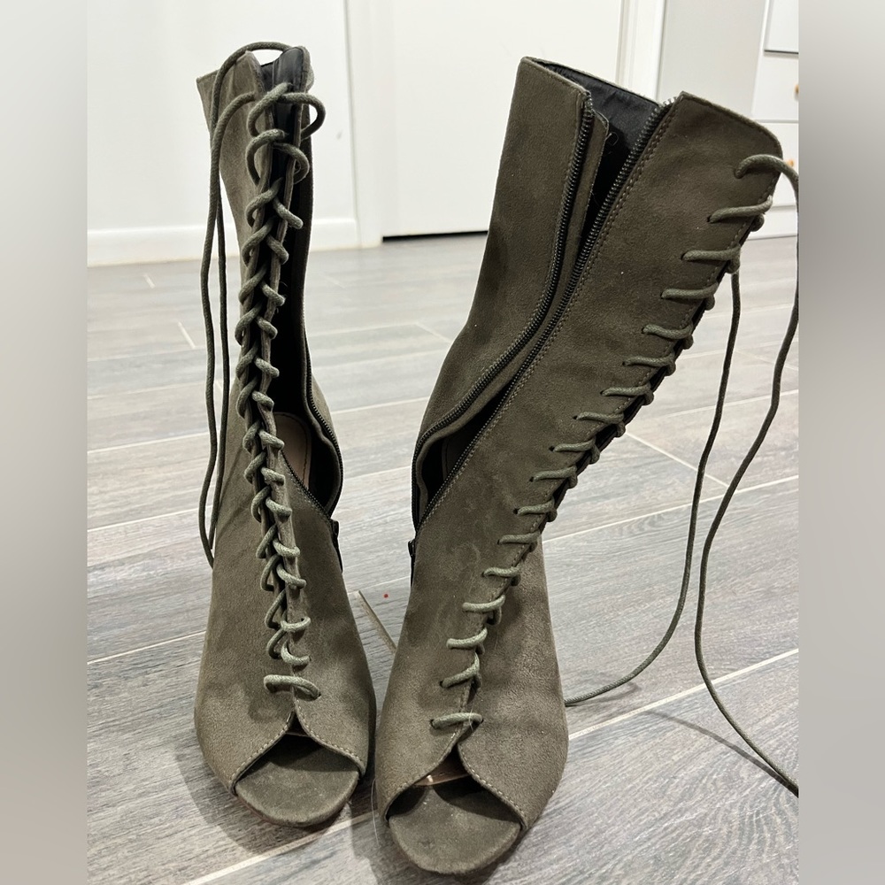 Green shin tie up boot heel